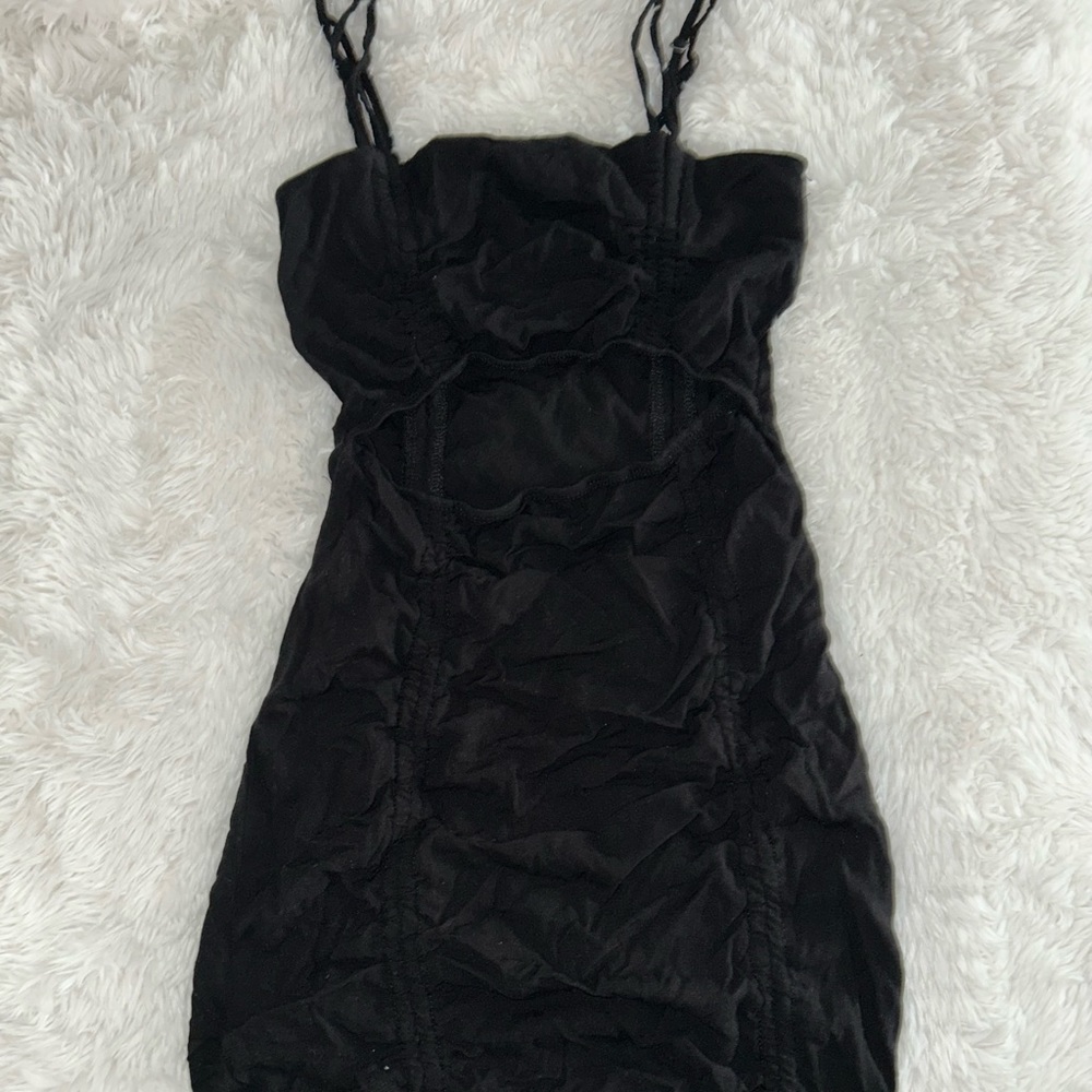 Black dress. Cut out near rib cage